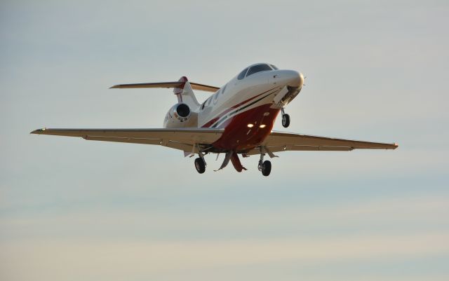 Beechcraft Premier 1 (N46CK) - Premier 1/A climbing away with gear in transit at PYM.