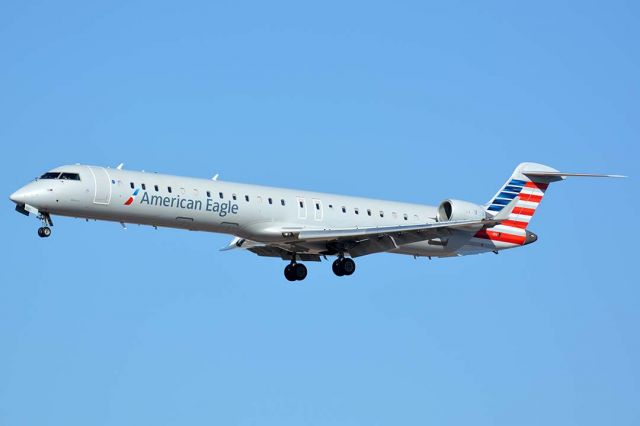 Canadair Regional Jet CRJ-900 (N921FJ) - American Eagle Canadair CL-600-2D24 N921FJ at Phoenix Sky Harbor on January 17, 2016. It is operated by Mesa Airlines. Its construction number is 15021. It was delivered to Mesa Airlines on June 9, 2004.