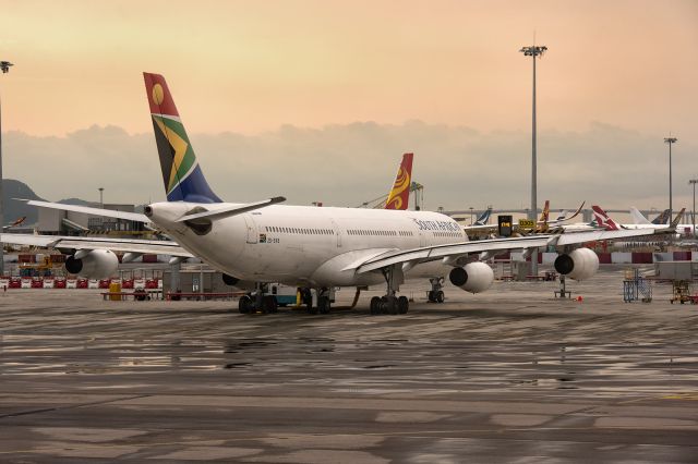 Airbus A340-300 (ZS-SXB) - 12th August, 2019: Minutes before the airport was shut down due to the protests in Hong Kong, SAA's A343 is seen parked on the ramp at Chek Lap Kok International. 