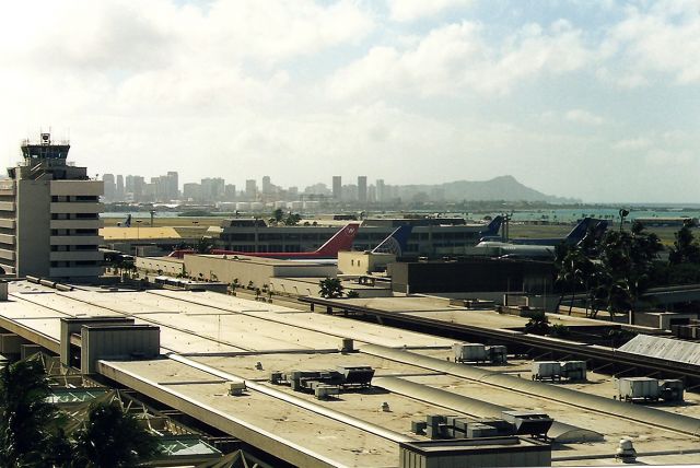 — — - PHNL- old Tower view from atop the parking garage. Can you spot the Wiki Wiki shuttle? ThisTower was famous in the old 1960 TV series of Hawaii 5 0. I loved that show!