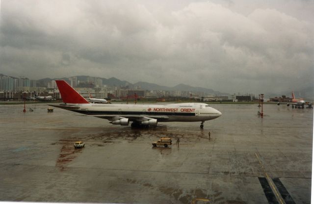 Boeing 747-200 (N628US) - N628US at HKG Kai Tak,date unknown. Note Flying Tigers B747,CP Air 747 and Korean Airlines B707 in background.