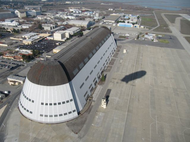 N704LZ — - Shadow of modern Zeppelin over old Hangar 1 at Moffett -- Dec 1, 2009