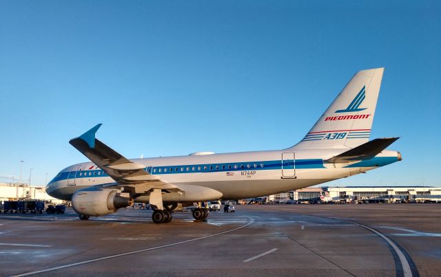 Airbus A319 (N744P) - Piedmont retro arriving at the gate from PVDbr /br /12/16/18