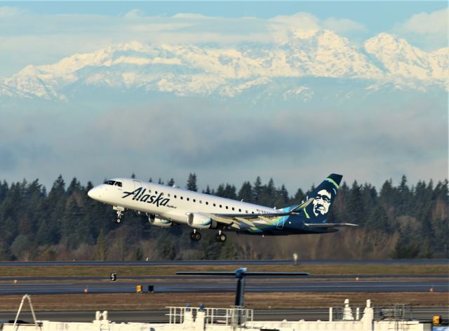 Embraer 175 (N400SY) - KSEA - Alaska Skywest departing for Fresno,CA off 16L with the Olympic Mountain Range west of Seattle in the background.