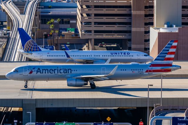 Airbus A321 (N151AN) - An American Airlines A321 taxiing at PHX on 2/12/23 during the Super Bowl rush. Taken with a Canon R7 and Canon EF 100-400 II L lens.