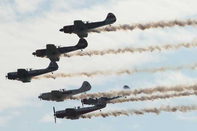 — — - Aerobatic flying display at Duxford Air Museum.