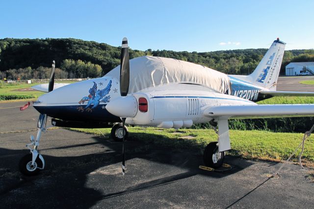 Cessna Executive Skyknight (N320VM) - Classic design for piston twins. Great paintjob! RELIANT AIR has the lowest fuel price on the Danbury (KDXR) airport.