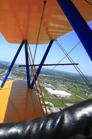 — — - A shot of North Wichita from a PT-17