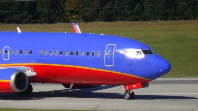 BOEING 737-300 (N618AW) - Southwest 2542 turning off runway 5L.  Taken October 27, 2014.