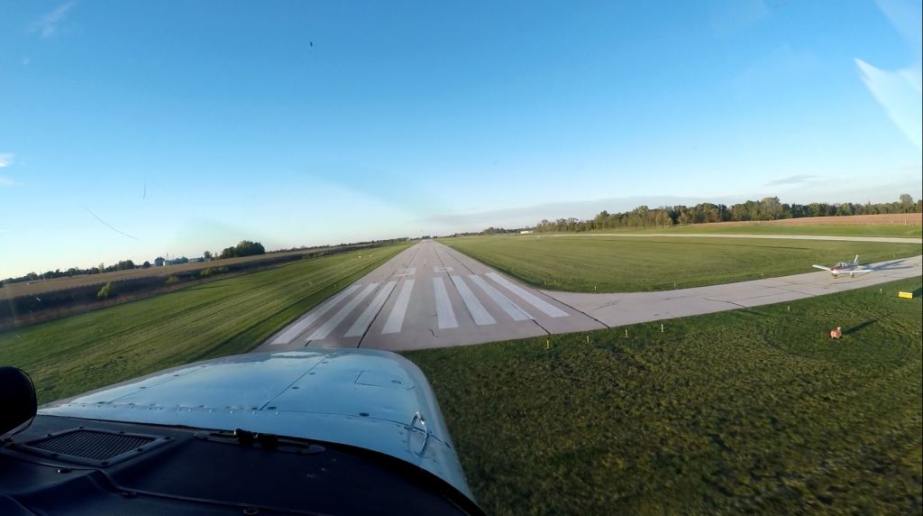 Cessna Cutlass RG (N9421D) - Landing at 2R2 with a piper Warrior holding short.