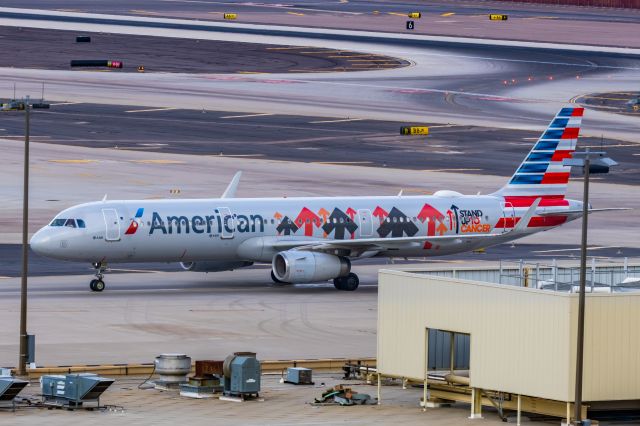 Airbus A321 (N162AA) - An American Airlines A321 in Stand Up to Cancer special livery taxiing at PHX on 2/13/23, the busiest day in PHX history, during the Super Bowl rush. Taken with a Canon R7 and Canon EF 100-400 II L lens.