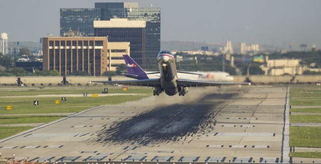 McDonnell Douglas MD-80 — - An American maddog blasts off from 31L while the FedEx next up for departure taxis into positionbr /9/12/17