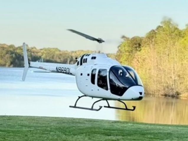 Bell 505 (N969DL) - Helicopter landing at lake