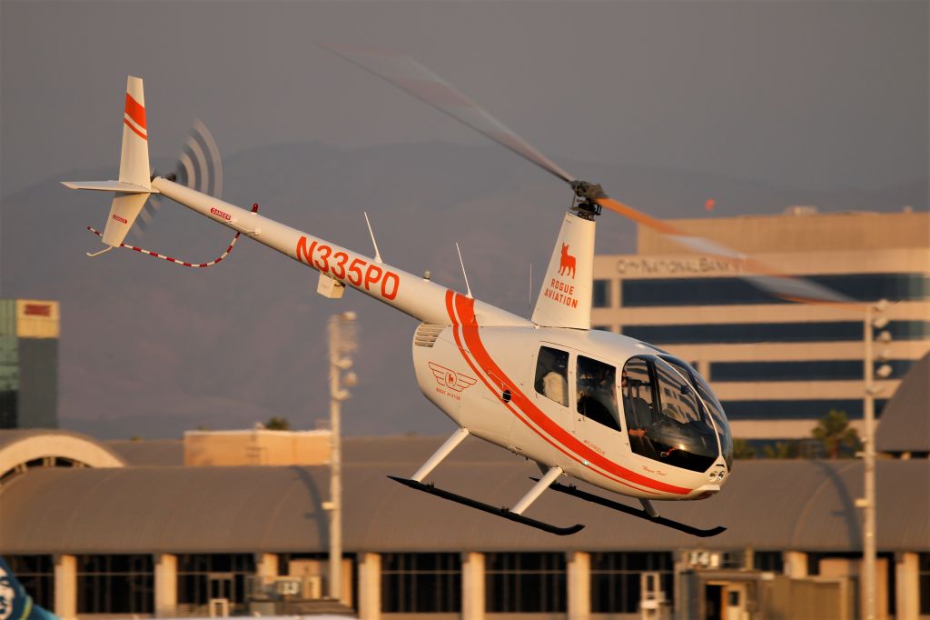 Robinson R-44 (N335PD) - R44 Raven II taking off from JWA.