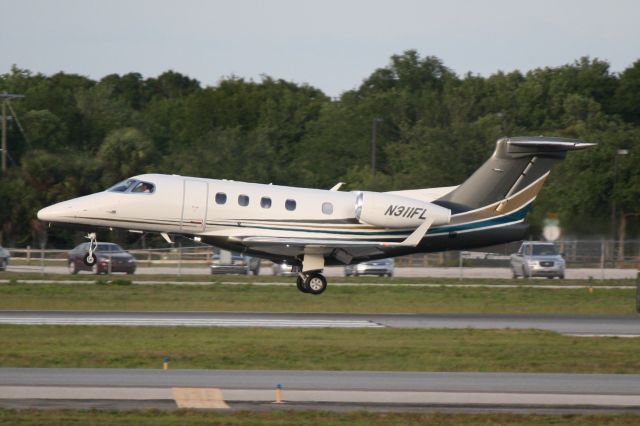 Embraer Phenom 300 (N311FL) - Options Flight 311 (N311FL) arrives on Runway 32 at Sarasota-Bradenton International Airport following a flight from Buffalo-Niagara Falls International Airport