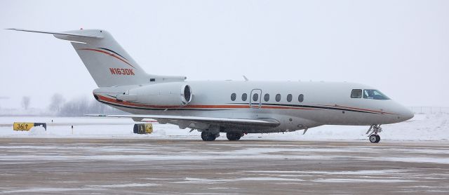 Hawker Beechcraft 4000 (N163DK) - Arrival at KDBQ in the midst of a snowstorm.