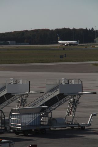 Boeing 737-700 — - In the foreground two aircraft stairs and in the background of the arrival of a Boeing 737-800 from Ryanair at Eindhoven Airport (Holland). (Saturday, October 13th, 2018)