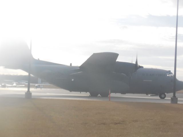 Lockheed C-130 Hercules (UNKNOWN) - When we arrived at the airport we notice that there was this HUGE Gray Turboprop parked up at probably the ramp, and after we left the Observation Area (We are now EAA Members, PLANESPOTTING AT DEH DECK BABY!!!!) we went up to go to the Ramp dude, and you guess it! To go see the C-130, I Mean i got a couple more shots and even a video showing the aircraft, but i mean i dont want to spam photos on the same type of encounter! This was actually the same area that we saw the B732 VP-CDA from, accept VP-CDA was parked next to the Saab 340, while the C-130 however was parked rear by the left side of said Saab 340. Unfortunately the C-130 was also parked on the side of the SUN!!, so i had to force my little camera to take in extremely more light then it normally gets, it was still a good picture.br /have a good day everybody! please make sure to comment and vote because it is my Inspiration!br /see you later, peace!