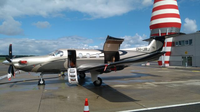 Pilatus PC-12 (OH-JRJ) - I was standing just outside of the fence, near the tower on the southeast side of the airport