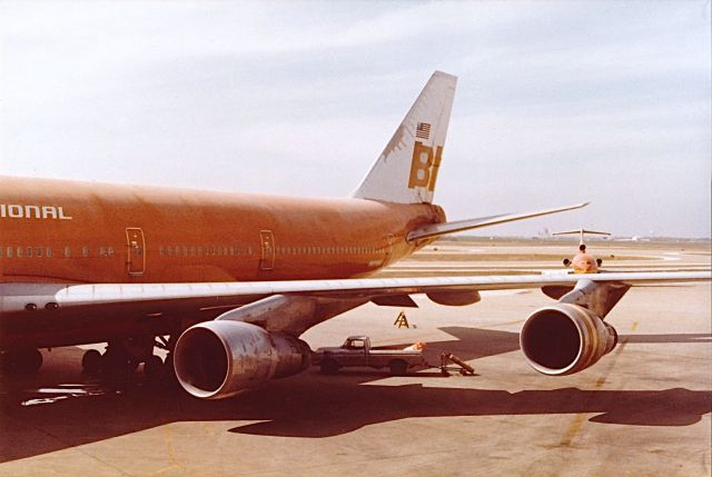 Boeing 747-200 (N602BN) - Braniff International Airlines B-747 being ready for another trip to Hawaii. Note the need for a paint job on the tail.