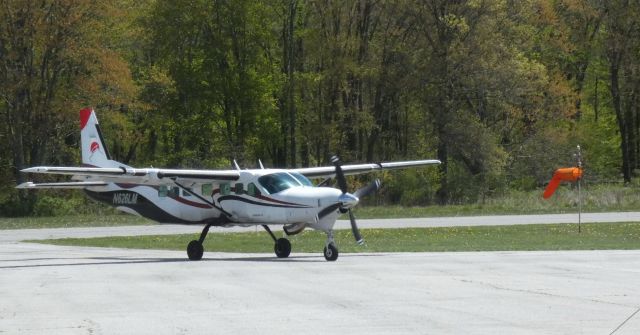 Cessna Caravan (N626LM) - Returning to parking after a Skydiver deployment is this 1998 Cessna 208B Grand Caravan in the Spring of 2023.