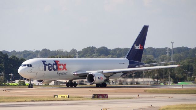 BOEING 767-300 (N131FE) - "Alanis" on takeoff roll down 18R.