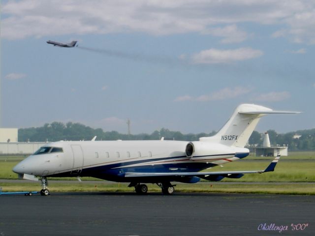 Bombardier Challenger 300 (N512FX) - Just a day to enjoy the Tarmac.  No Challenge today in this Summer of 2005.