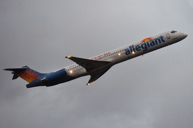 McDonnell Douglas MD-83 (N872GA) - All lit up on departure on a hazy evening.