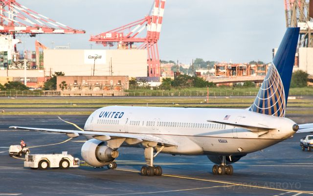 Boeing 757-200 (N566UA) - UAL 752 pushing back at EWR in June 2012