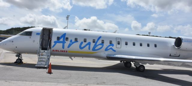 Canadair Regional Jet CRJ-200 (C-FXLH) - Aruba Airlines parked at the stand after maiden flight.