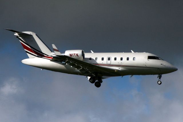 Canadair Challenger (N1TK) - On short finals for rwy 10L on 18-Oct-18 arriving from KSRQ.