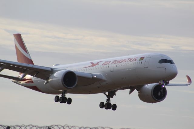 Airbus A350-900 (3B-NBP) - An Air Mauritius A350-900 on final approach into LHR, landing on runway 27R.br /br /Location: Stanwell Moor Road (LHR), beside runway 27R.br /Date: 21.08.22 (dd/mm/yy)