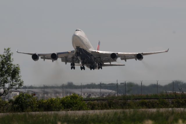 Boeing 747-400 (N664US) - Just found out that this aircraft was severely damaged by hail enroute to ICN on this flight 159 DTW-ICN. Lucky Catch for me. She was fine when she left DTW as you can see! Shot this departing DTW on 06-16-15