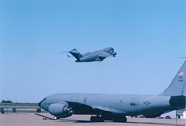 Boeing C-135B Stratolifter (57-1435) - KC-135 on the ramp at KAFW after an air show with a C-17 departing in the back ground