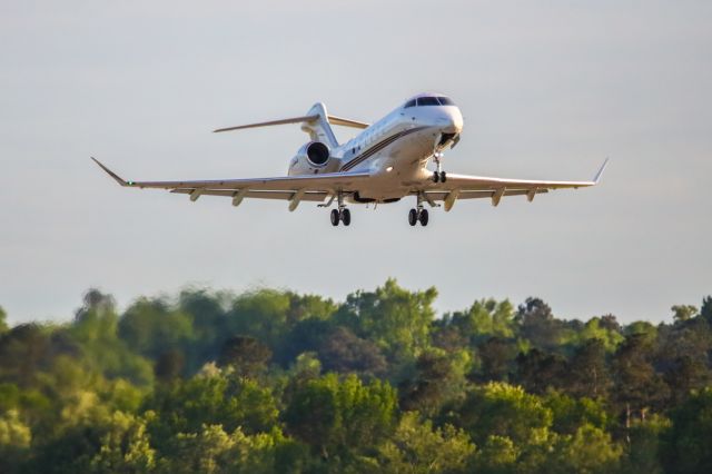 Bombardier Challenger 300 (N726QS) - N726QS is a 2016 Bombardier Challenger 300, seen here departing Augusta Georgia's regional airport shortly after the conclusion of the 2023 Masters golf tournament. I liked this photo, not only because of the aircraft, but the evening sun was lighting up the trees in the background really nicely. I shot this with a Canon 5Dsr and a Canon 500mm lens with a 1.4x extender on it making the lens' focal length 700mm. Camera settings were 1/8000 shutter, F5.6, ISO 1600. Please check out my other aviation photography. Votes and positive comments are always appreciated. Questions about this photo can be sent to Info@FlewShots.com