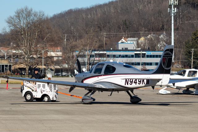 Cirrus SR22 Turbo (N949KM) - A SR-22 Turbo being moved into a hangar at Lunken Airport. 