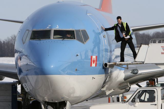 Boeing 737-800 (C-FRZJ) - January 11, 2011 - waited for the door to open at London Airport 