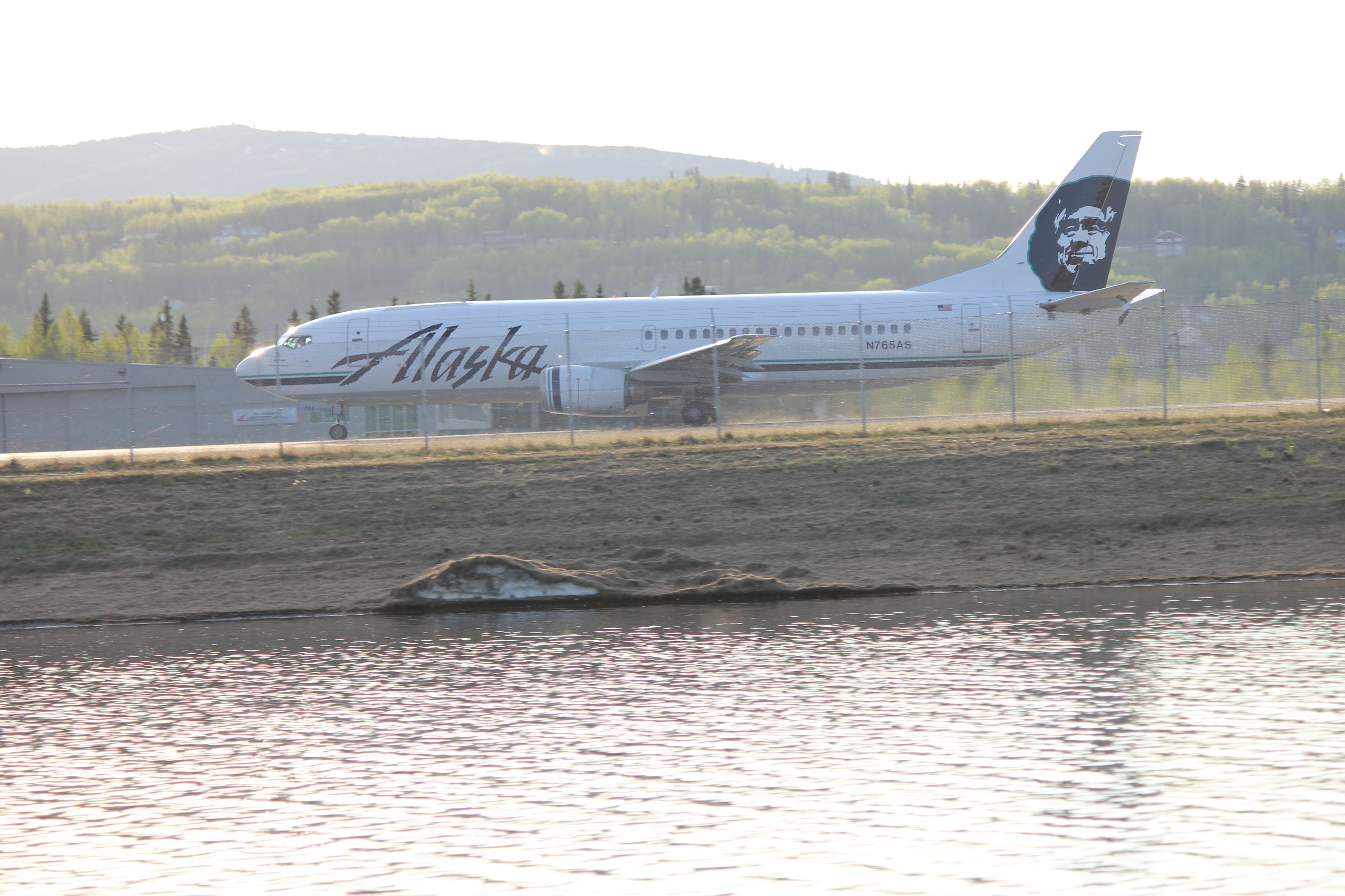 N765AS — - 1 of Alaska Airlines Q400. Note the cargo door up front. She can go full cargo or half cargo and passengers.