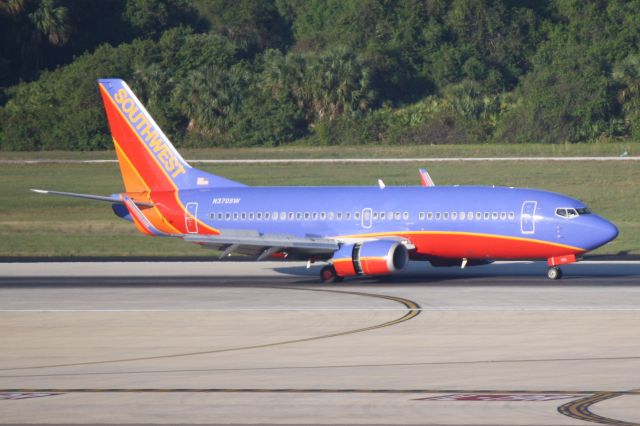 BOEING 737-300 (N370SW) - Southwest Flight 2059 (N370SW) arrives on Runway 1L at Tampa International Airport following a flight from Louisville International Airport