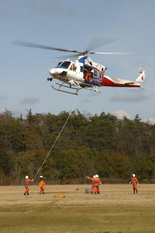 JA6774 — - Hiroshima Prefectures Bell 412 EP Rescue helicopter during a rescue practice session at Hiroshima airport 