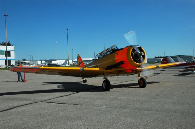 North American T-6 Texan (N1811B) - North American Harvard Mk IV (Serial 20247)starting its engines during the Doors Open event at CYOO/YOO (September 25, 2015)