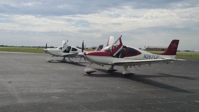 Cirrus SR-22 (N267HH) - On the ramp at Sparks Aviation...sitting next to another company plane N267HH