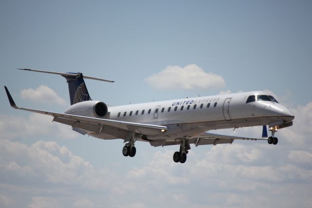 Embraer EMB-145XR (N24103) - Landing on 35L.