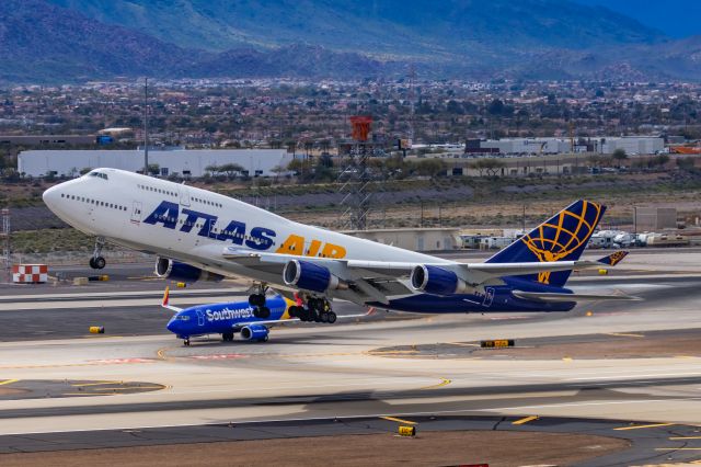 Boeing 747-400 (N481MC) - An Atlas Air 747-400 taking off from PHX on 2/13/23, the busiest day in PHX history, during the Super Bowl rush. Taken with a Canon R7 and Canon EF 100-400 II L lens.