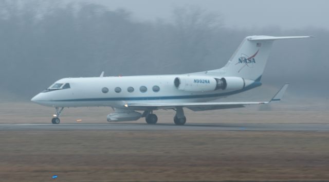 Gulfstream Aerospace Gulfstream 3 (N992NA) - NASA2 with the UAVSAR pod mounted for an airborne science SnowEx mission, prepares to depart under sketch weather minimums from KEFD