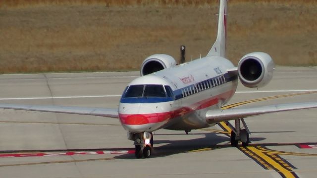 Embraer ERJ-135 (N827AE) - N827AE turning onto taxiway B from B5 after arrival on runway 5L.