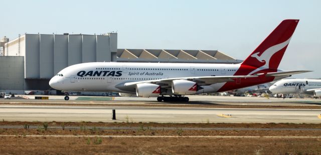 Airbus A380-800 (VH-OQB) - Taxiing for takeoff at 24L, I shot this image from arriving Southwest flight # 1091 (KSJC-KLAX) As can be seen to the right, there was a second A380 parked, on the tarmac.