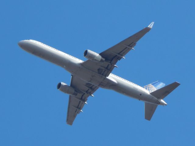 Boeing 757-200 (N12114) - N12114, a 1995 Boeing B757-200, flies over my home on approach to Dulles International Airport in Late Winter 2021.