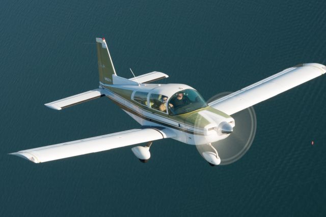 Grumman AA-5 Tiger (N4557V) - Flying over Folsom Lake, CA, trying out a new camera and lens - this one was shot slow to try and capture a full propeller blur.br /©2012 Andy Robinson