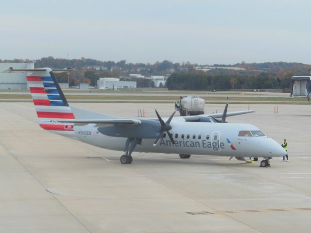 de Havilland Dash 8-300 (N343EN) - American Eagle/Piedmont Airlines (AA/PT) N343EN DHC-8-311 [cn340]br /Greensboro Piedmont Triad (GSO). American Eagle/ Piedmont Airlines flight AA4723/PT4723 readies for departure to Charlotte (CLT). br /Taken from NE corner perimeter fence, Old Oak Ridge Road/Inman Road intersectionbr /2014 11 04  a rel=nofollow href=http://alphayankee.smugmug.com/Airlines-and-Airliners-Portfolio/Airlines/AmericasAirlines/American-Eagle-AAAXCPENEVMQOHOOYVYXZWhttps://alphayankee.smugmug.com/Airlines-and-Airliners-Portfolio/Airlines/AmericasAirlines/American-Eagle-AAAXCPENEVMQOHOOYVYXZW/a  